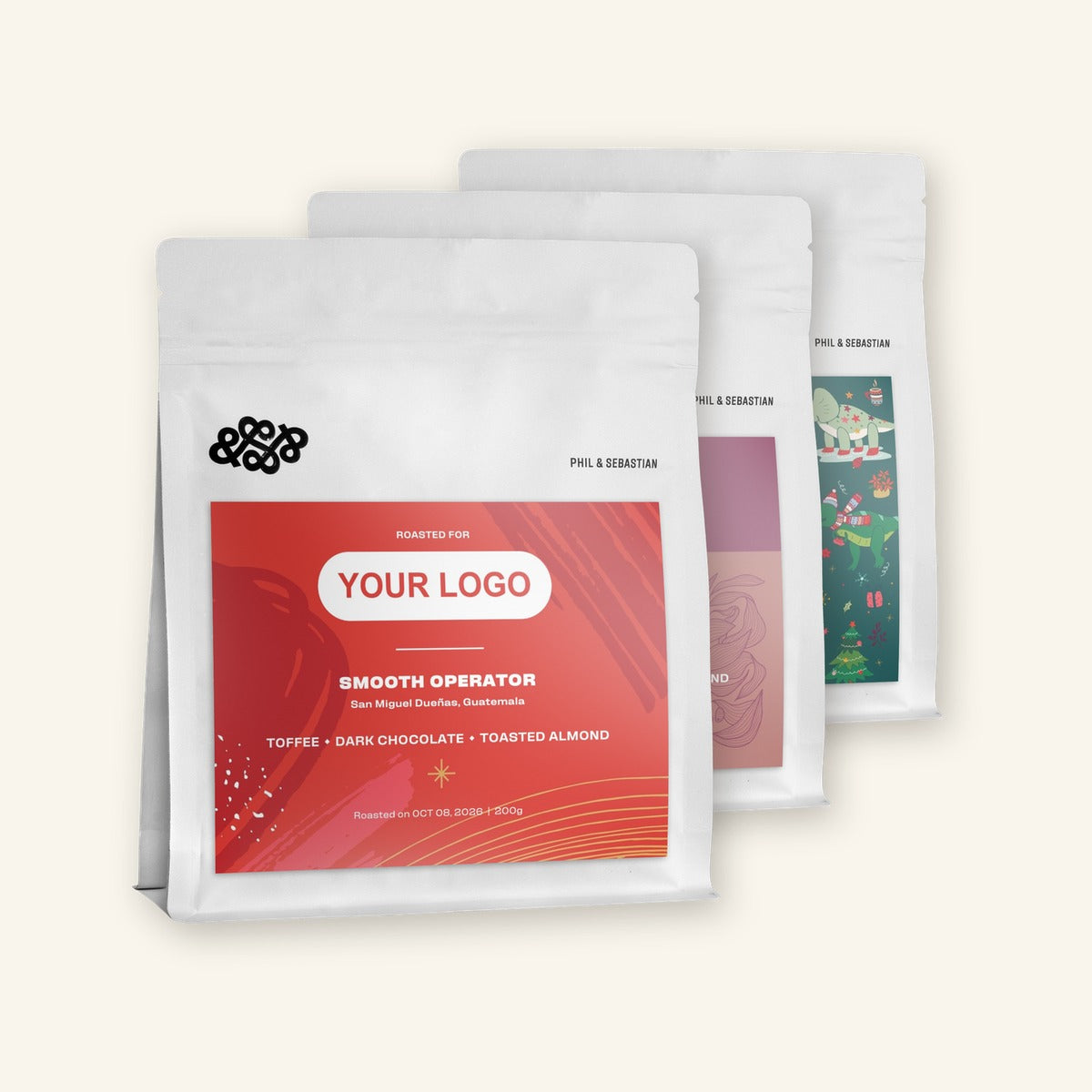 Three bags of Phil & Sebastian coffee, each with a YOUR LOGO label